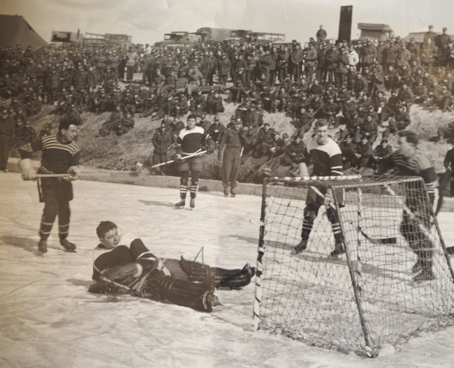 Canadian soldiers play hockey on the Imjin River in January 1952 (Dennis Moore)