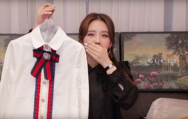 Beauty vloggers introduce luxury goods they have purchased. The two vloggers spent more than 15 million won ($14,000) each buying clothes, bags and shoes. (YouTube)