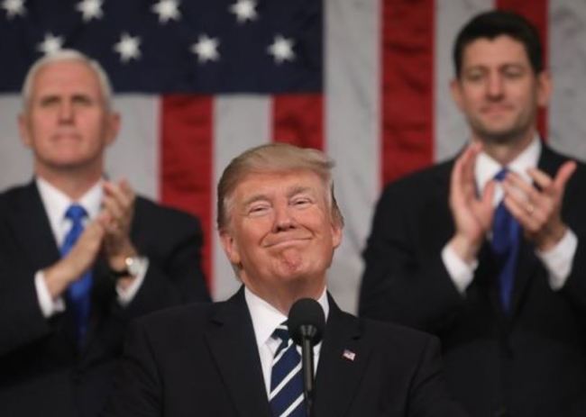President Donald Trump smiles as delivers his first State of the Union address in the House chamber of the U.S. Capitol to a joint session of Congress Tuesday, Jan. 30, 2018 in Washington, as Vice President Mike Pence and House Speaker Paul Ryan applaud. (AP)