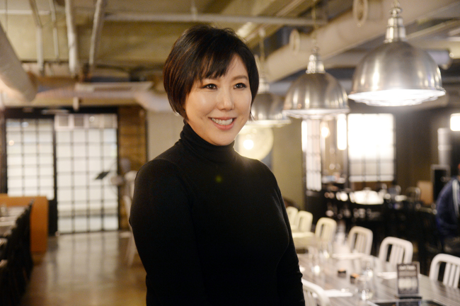 Yoo Ji-young poses in her restaurant Tongue & Groove Joint in Itaewon. (Park Hyun-koo/The Korea Herald)