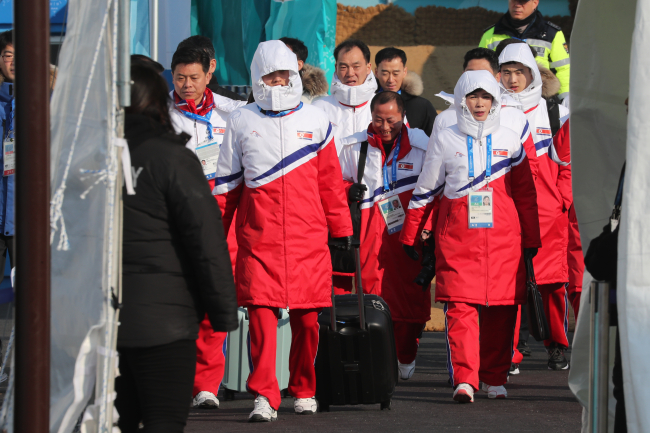 North Korean athletes and officials head to a training session at the athletes` village in Gangneung, Gangwon Province on Saturday. Yonhap