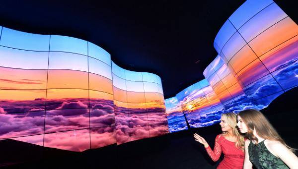 LG Electronics displays its 90-foot-long LG OLED Canyon made of 246 sheets of curved 55-inch organic-light-emitting diode panels at this year’s Consumer Electronics Show in Las Vegas. (LG Electronics)
