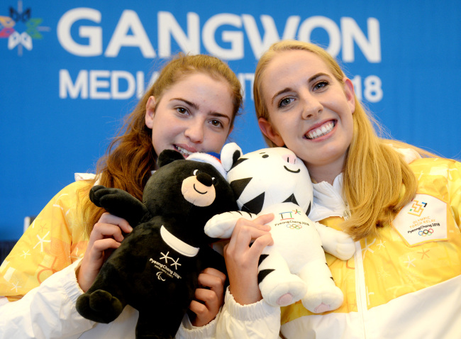 Tamara Jacobs (left) and Chelsea Jacobs of the South African team pose during a press conference at the Gangwon Media Center at Seamarq Hotel in Gangneung, Gangwon Province, Thursday. (Park Hyun-koo/The Korea Herald)