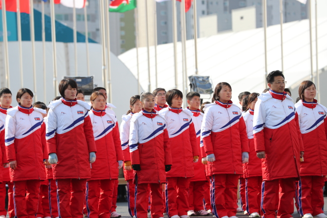 North Korean athletes attend the ceremony for team's entrance into athletes' village for Olympics this week. (Yonhap)