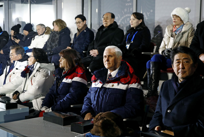 US Vice President Mike Pence, second from bottom right, sits between second lady Karen Pence, third from from bottom left, and Japanese Prime Minister Shinzo Abe at the opening ceremony of the 2018 Winter Olympics in Pyeongchang, South Korea, Friday, Feb. 9, 2018. Seated behind Pence are Kim Yong-nam, third from top right, president of the Presidium of North Korean Parliament, and Kim Yo-jong, second from top right, sister of North Korean leader Kim Jong-un. (Yonhap-AP)