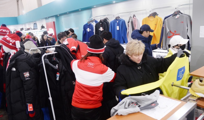 Customers look at winter clothes at Super Store in Gangneung Olympic Park. (Park Hyun-koo/The Korea Herald)