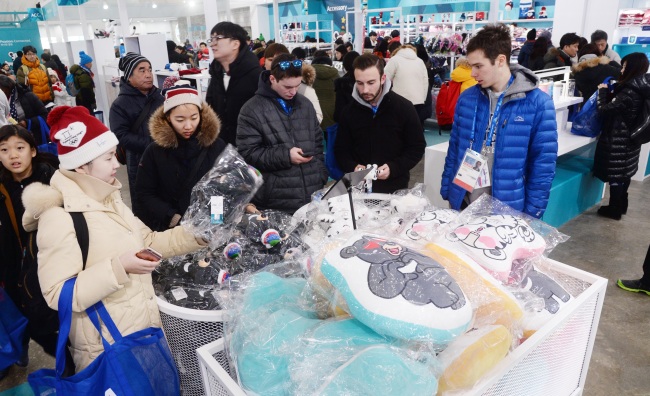 Customers browse Soohorang and Bandabi-themed products at Super Store in Gangneung Olympic Park. (Park Hyun-koo/The Korea Herald)