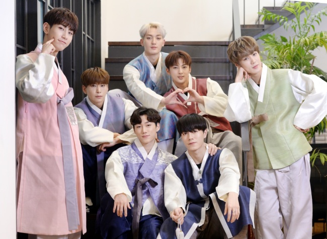 VAV poses after an interview with The Korea Herald in Seoul on Tuesday, wearing Korean traditional dress hanbok to celebrate the Lunar New Year holiday. (Park Hyun-koo / Korea Herald) 