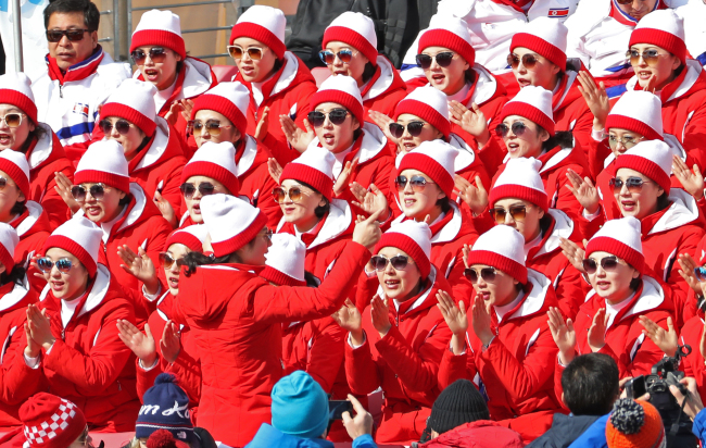 North Korean cheerleaders wear sunglasses at the men’s giant slalom games that started Sunday at 10:15 a.m.