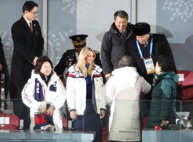 President Moon Jae-in (second from right), next to US President Donald Trump`s daughter Ivanka Trump (center), shakes hands with North Korean chief delegate Kim Yong-chol (back) during the closing ceremony of the PyeongChang Olympics in PyeongChang, Gangwon province, Sunday. (AFP-Yonhap)