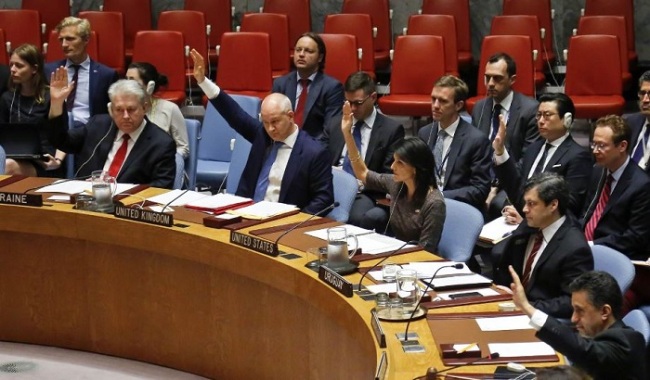 Ambassadors to the United Nations raise hands in a Security Council resolution vote to sanction North Korea at UN headquarters on June 2, 2017 in New York. (AP)
