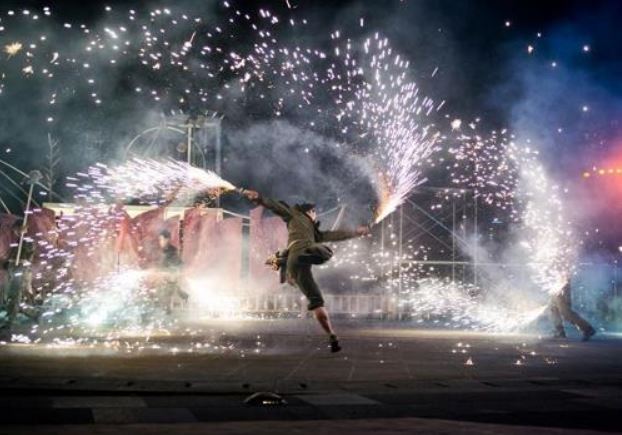 A performer dances with sparklers during 