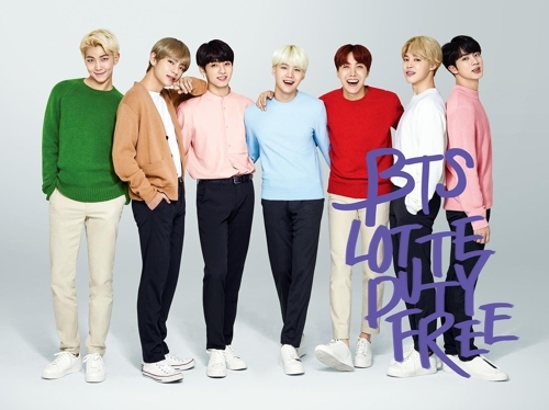 In this undated photo provided by Lotte Duty Free, South Korea`s top duty-free operator, members of the K-pop boy band BTS pose for a photo. (Yonhap)