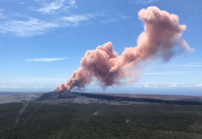 In this photo provided by the US Geological Survey, red ash rises from the Puu Oo vent on Hawaii`s Kilauea Volcano after a magnitude-5.0 earthquake struck the Big Island, Thursday, May 3, 2018 in Hawaii Volcanoes National Park.