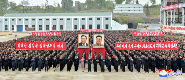 North Koreans celebrates the annual labor day at a steel making plant site in Hwanghae Province on May 1. (Yonhap)