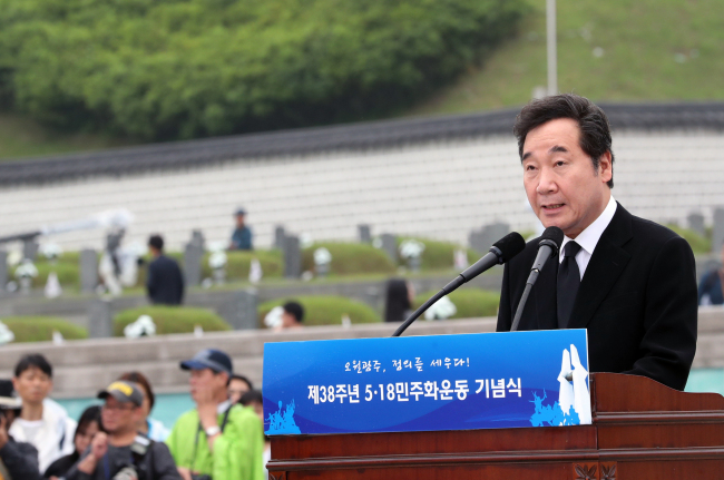 Prime Minister Lee Nak-yon speaks at the 38th commemoration of the May 18 Democratization Movement at May 18 National Cemetery in the southwestern city of Gwangju on Friday. (Yonhap)