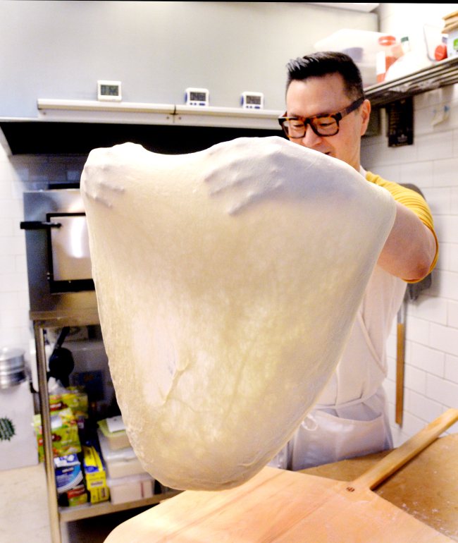 Slice owner Alex Ham tosses pizza dough. Park Hyun-koo/The Korea Herald
