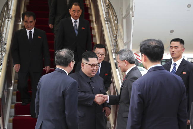 A handout photo taken by Ministry of Communications and Information of Singapore on June 10, 2018 shows North Korean leader Kim Jong-un arriving at Singapore International airport in Singapore. (AFP-Yonhap)
