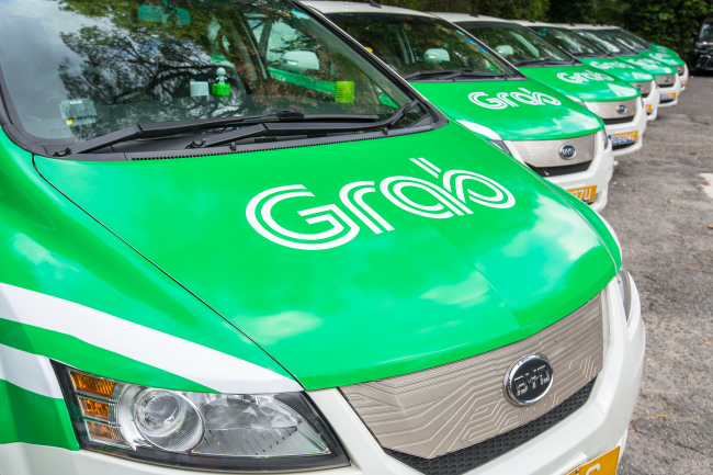 Grab vehicles are seen in a parking lot in Singapore (Grab)