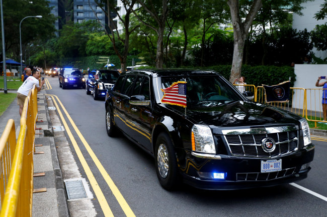 The motorcade of US President Donald Trump travels towards Sentosa for his meeting with North Korean leader Kim Jong-un, in Singapore on Tuesday. (Reuters-Yonhap)