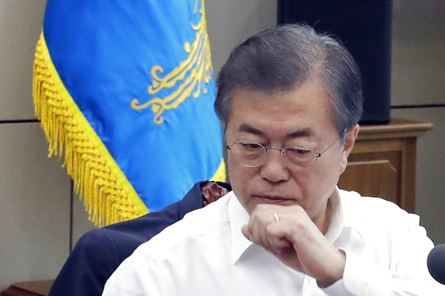 President Moon Jae-in at Monday`s meeting with top presidential aides. Yonhap