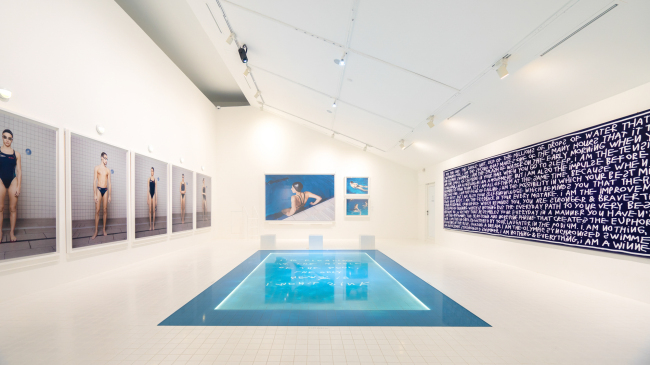 An installation view of “Ten Hours a Day, Six Days a Week: The Spanish Olympic Synchronized Swimming Team,” Coco Capitan‘s 2018 series that showcases images of the synchronized swimming team members. (Daelim Museum)