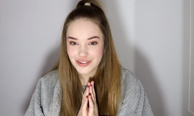 YouTuber Lexie Marie, 17, reacts to a K-pop music video on her channel. (YouTube)