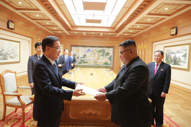 South Korea`s National Security Office chief and chief envoy to North Korea Chung Eui-yong hands President Moon Jae-in`s letter to North Korean leader Kim Jong-un in Pyongyang on Wednesday. Cheong Wa Dae