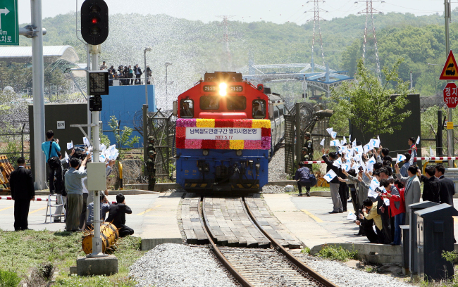 Following the decision to restore Gyeongui Line in 2007, a train crosses the border and heads toward the North Korean territory. Yonhap