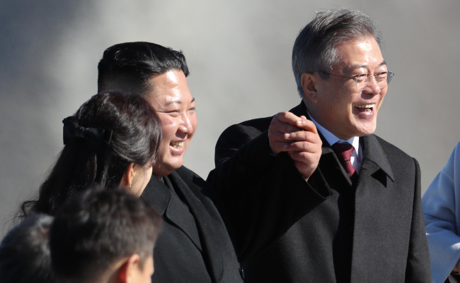 Kim Jong-un and Moon Jae-in pose on top of Paektusan. (Pyeongyang Press Corps.)