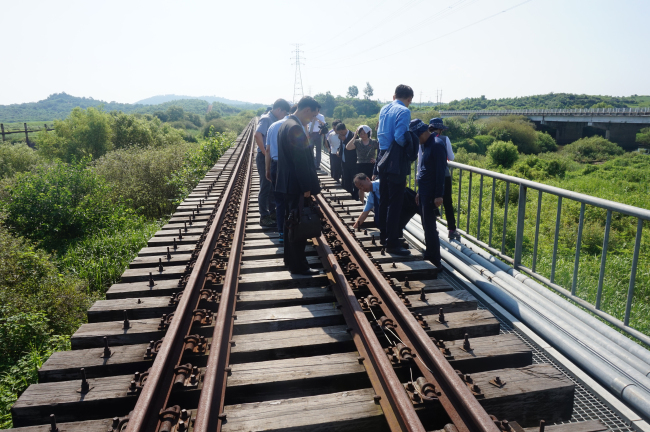South and North Korean officials inspect the North Korean side of the Gyeongui Line on July 24. (Yonhap)