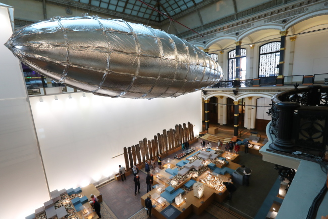 The installation `Willing to be vulnerable` by artist Lee Bul hangs in the main hall of the Martin Gropius Bau as part of the exhibition `Lee Bul: Crash` at the Martin Gropius Bau in Berlin on Friday. (EPA-Yonhap)