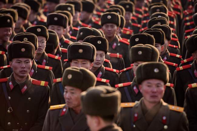 Korean People’s Army soldiers gather as they prepare to pay their respects before the statues of late North Korean leaders Kim Il-sung and Kim Jong-il as part of celebrations marking the birthday of late North Korean leader Kim Jong-il, known as the “Day of the Shining Star,” on Mansu hill in Pyongyang on Feb. 16. (AFP-Yonhap)