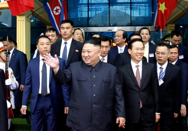 Kim (center) waves as he arrives at Dong Dang Railway Station in Lang Son province, Vietnam, Tuesday, ahead of the US-North Korea summit in Hanoi. (EPA-Yonhap)