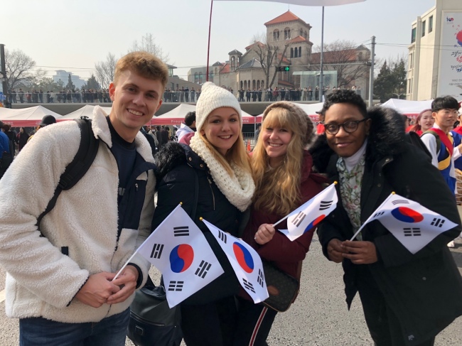 Timothee Chambourdon, 22, from France, Isabel Faller, 22, from Germany, Yasmin Mayer, 20, from Germany, and Jeremy Moutou, 24, from France pose for a photo during an event to mark the March 1 Independence Movement in central Seoul, Friday. (Ock Hyun-ju/The Korea Herald)