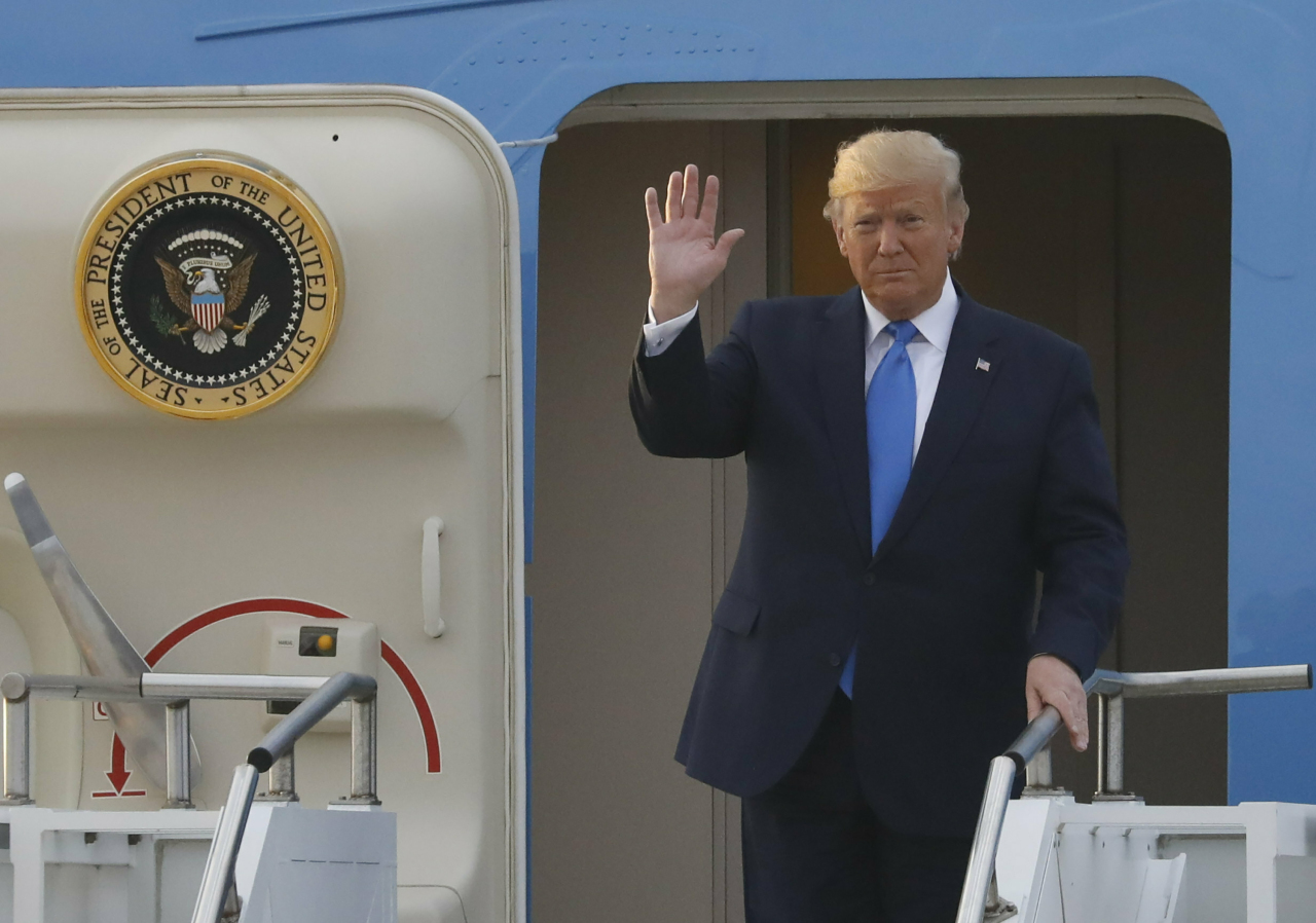 US President Donald Trump arrives at Osan Air Base in Pyeongtaek, Gyeonggi Province, Saturday. (AP)