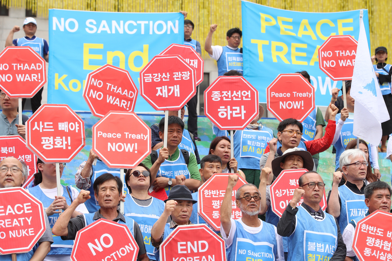 Members of the progressive civic group Solidarity for Peace and Reunification of Korea hold a press conference in front of the Sejong Center of the Performing Arts, protesting US President Donald Trump’s visit to Seoul on Sunday. (Yonhap)