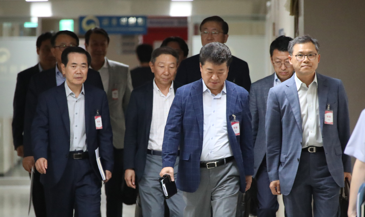 Executives from South Korean chipmakers attend emergency meeting held by Trade Ministry on Monday in Seoul. (Yonhap)