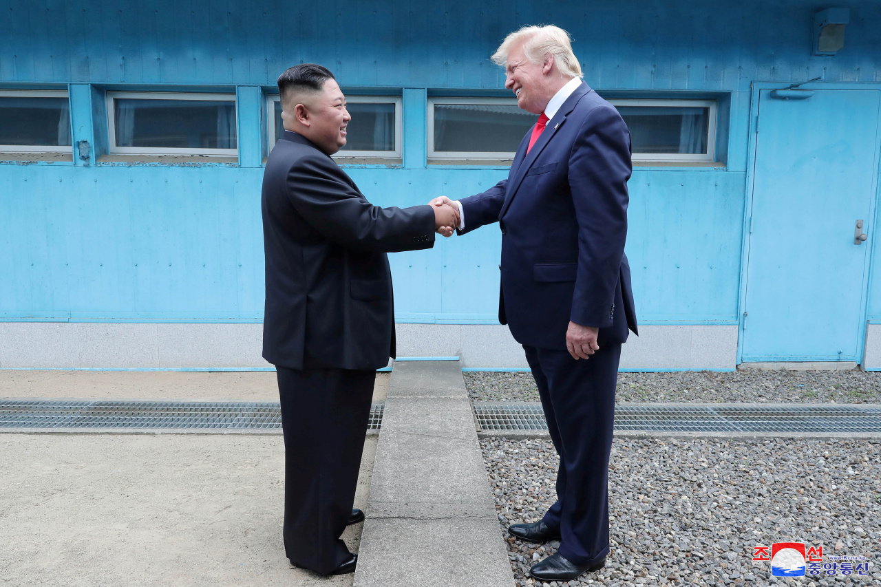US President Donald Trump shakes hands with North Korean leader Kim Jong-un as they meet at the demilitarized zone separating the two Koreas, in Panmunjom, South Korea, Sunday. (KCNA)