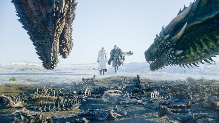 This image released by HBO shows Emilia Clarke, left, and Kit Harington in a scene from the final episode of 