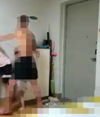 A 36-year-old Korean man beats his Vietnamese wife in front of their 2-year-old son at their home in Yeongan, South Jeolla Province, in video footage that went viral on social media in early July. (Yonhap)