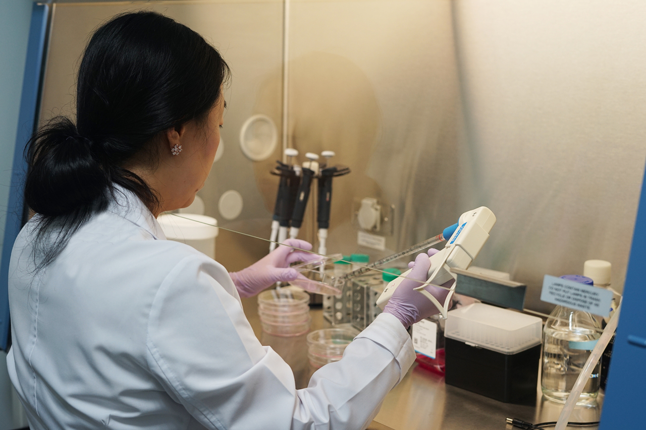A researcher at Bridge Biotherapeutics works in a laboratory. (Bridge Biotherapeutics)