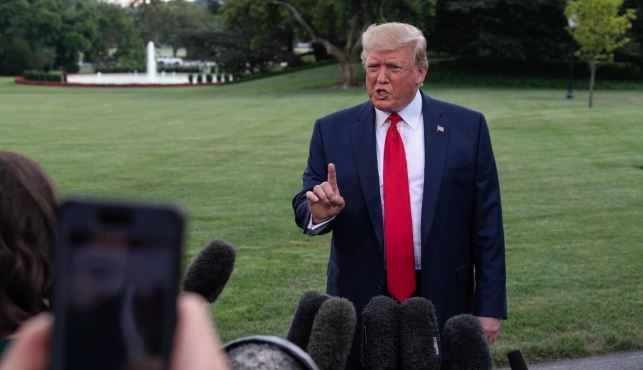 US President Donald Trump speaking to reporters at the White House in Washington. (AFP-Yonhap)