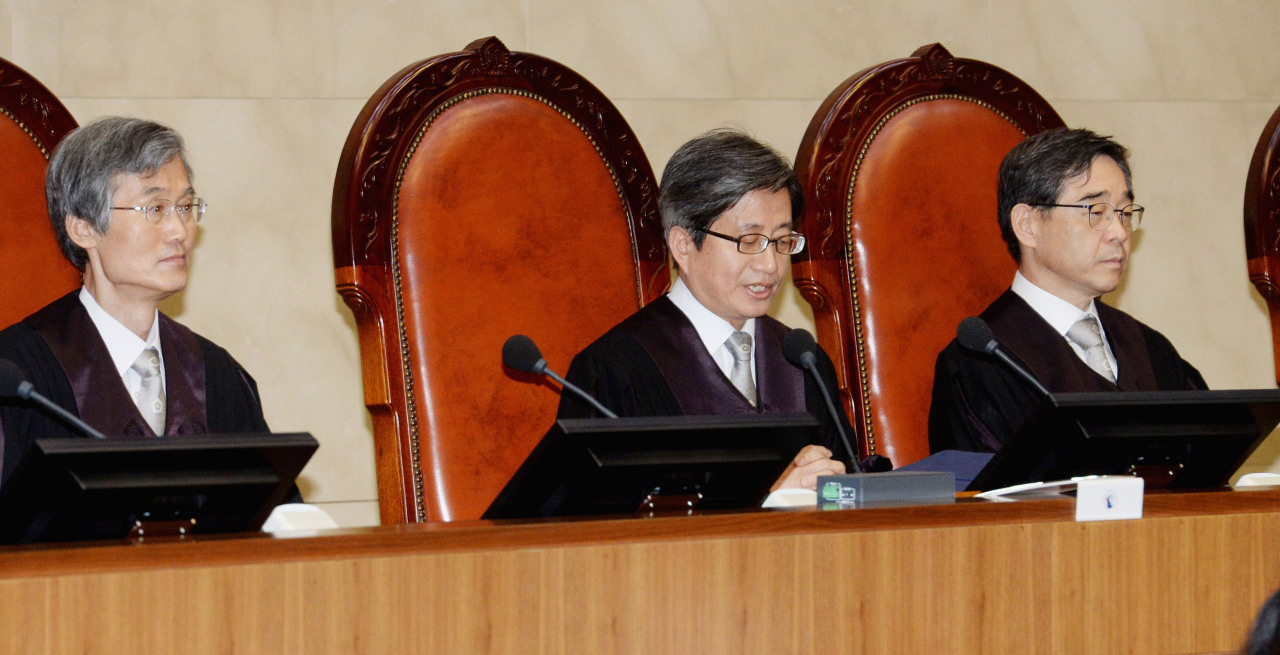 Supreme Court justices pass ruling on the cases on Thursday. Yonhap