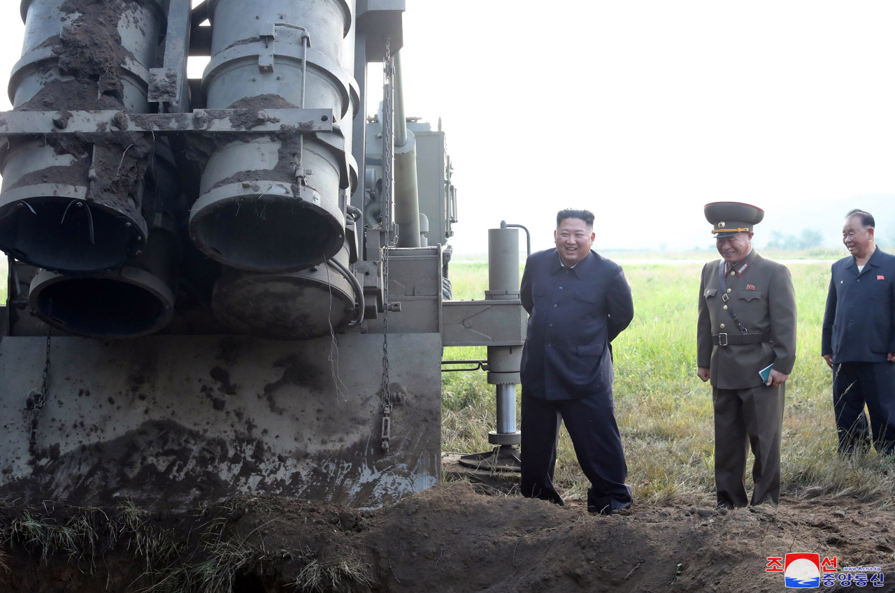 North Korean leader Kim Jong-un checks the 