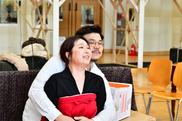 Members of the Korea National Opera, each playing Magnan Jang and his lover Seopseop, sing during a practice for opera “1945.” (Korea National Opera)