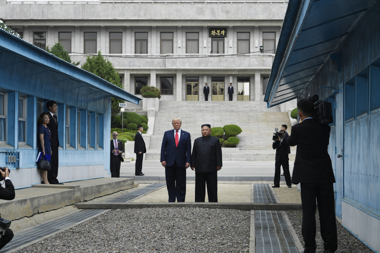 In this June 30, 2019, file photo, President Donald Trump meets with North Korean leader Kim Jong Un at the border village of Panmunjom in the Demilitarized Zone, South Korea. (AP-Yonhap)