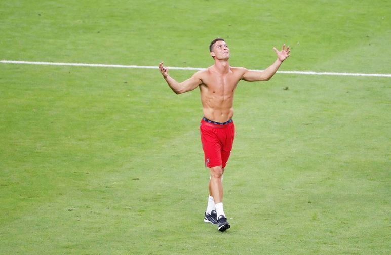 Cristiano Ronaldo of Portugal poses after his team beats France during the Euro 2016 final at Stade de France, though he was subbed in the first half of the match from an injury. (Reuters)
