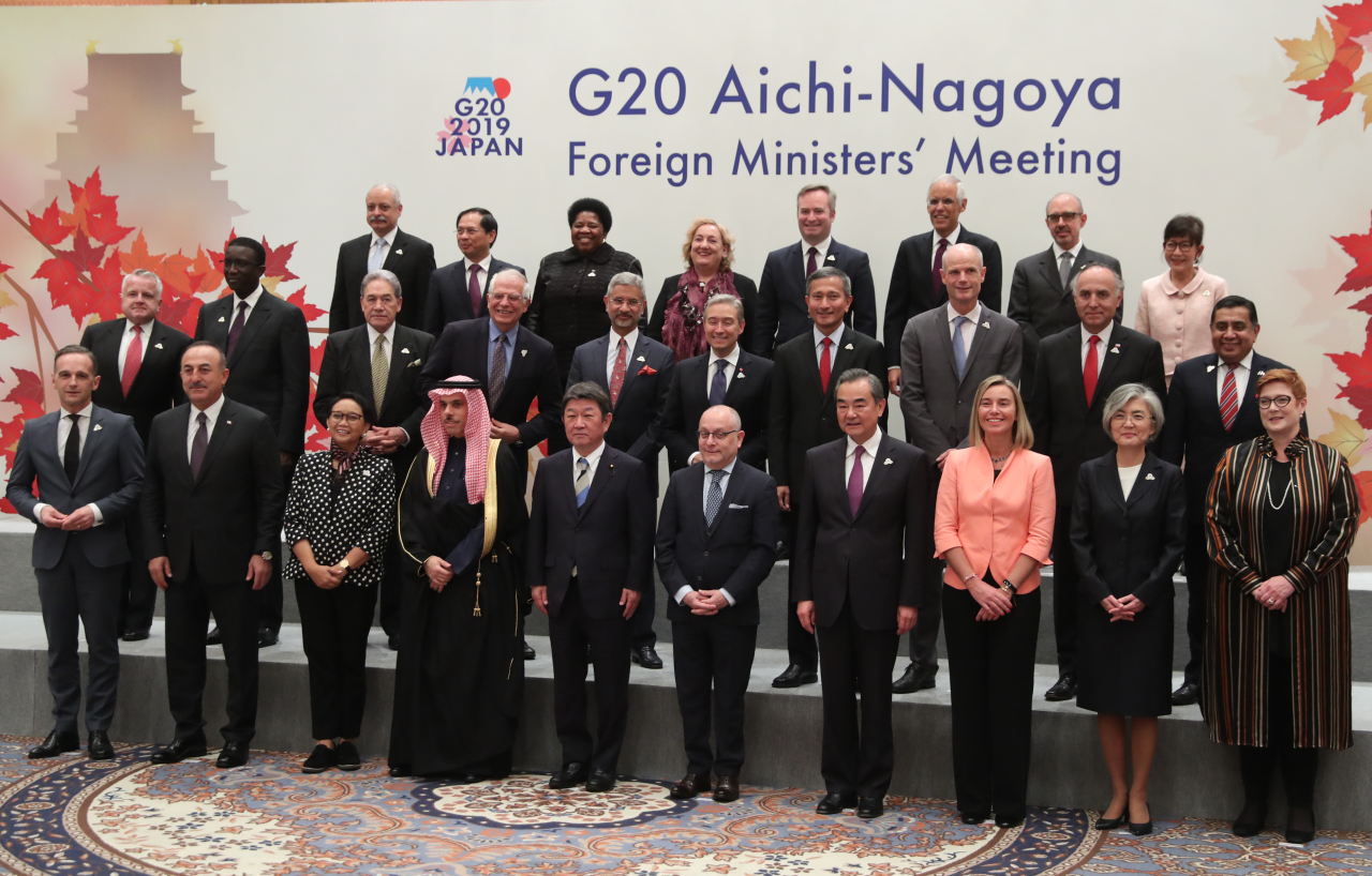 South Korean Foreign Minister Kang Kyung-wha (front row, second from right) and Japanese counterpart Toshimitsu Motegi (front row, fifth from left) on Saturday pose for official photograph at the Group of 20 ministerial summit held in Nagoya, Japan. (Yonhap)