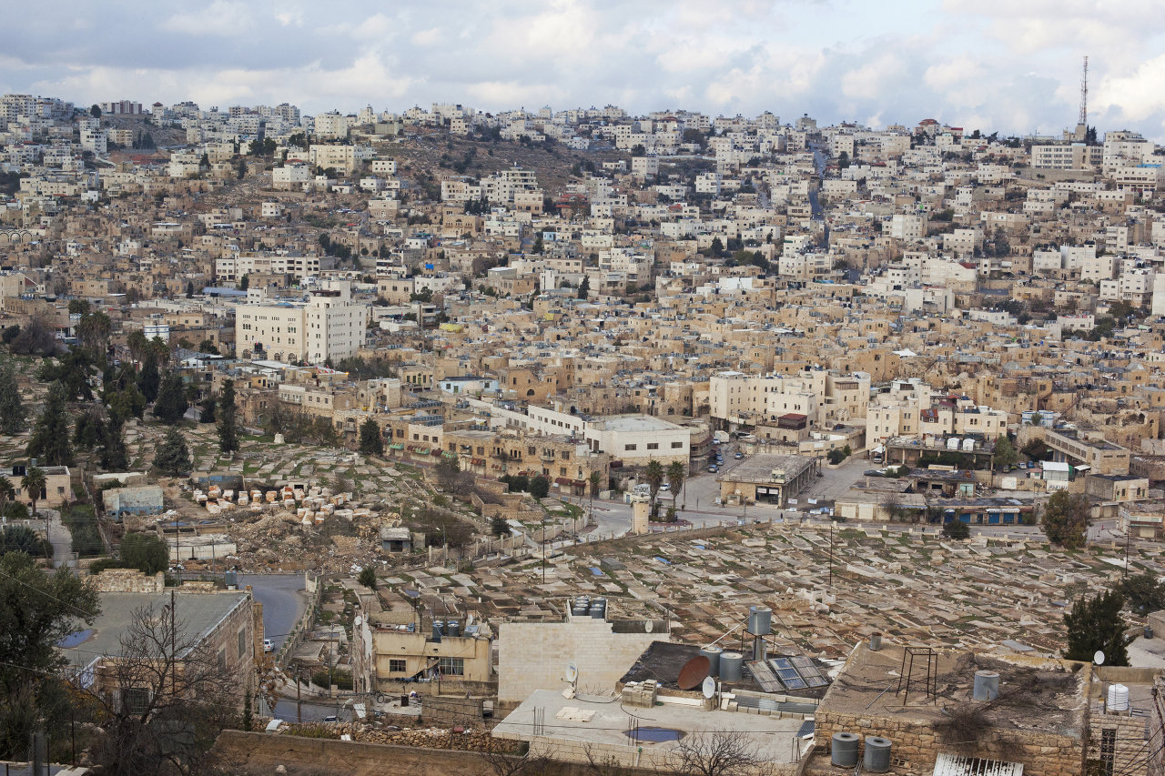 Ahlam Shibli’s photo from the “Occupation” series (2016-17) offers a view of a town in the city of al-Khalil, the Arabic name for Hebron. (SeMA)